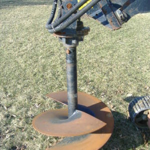Skidloader with Auger Attachment